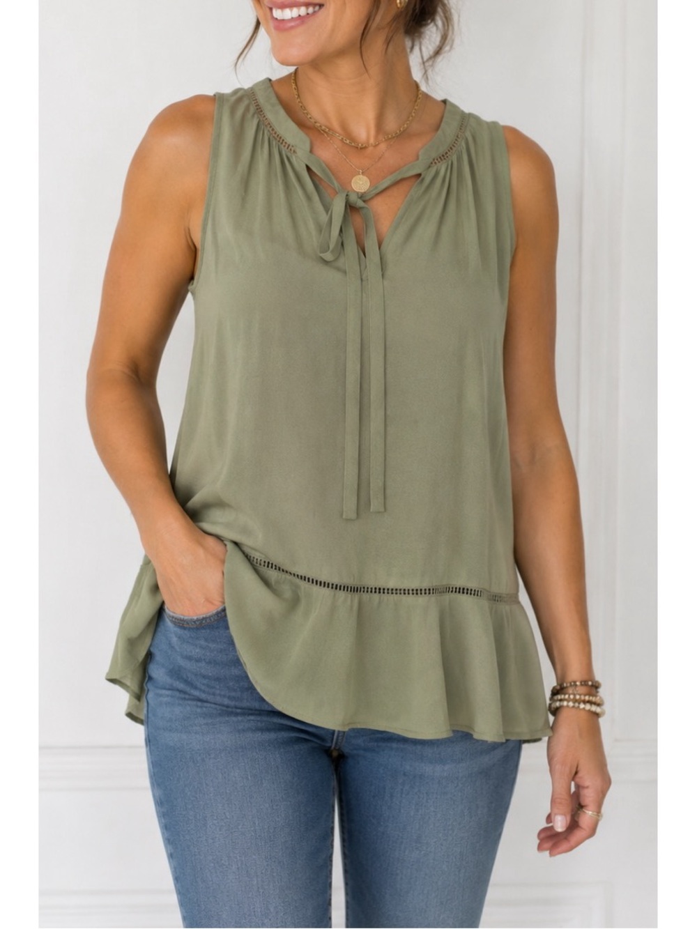 Mossimo olive green semi-sheer sleeveless blouse with a tie-neck and ruffle hem